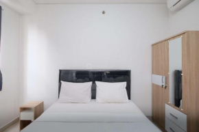 Fully Furnished and Cozy 2BR at Transpark Cibubur Apartment By Travelio